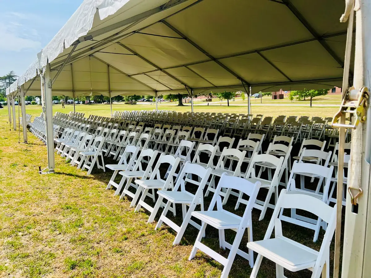 Seating laid out under a large frame tent